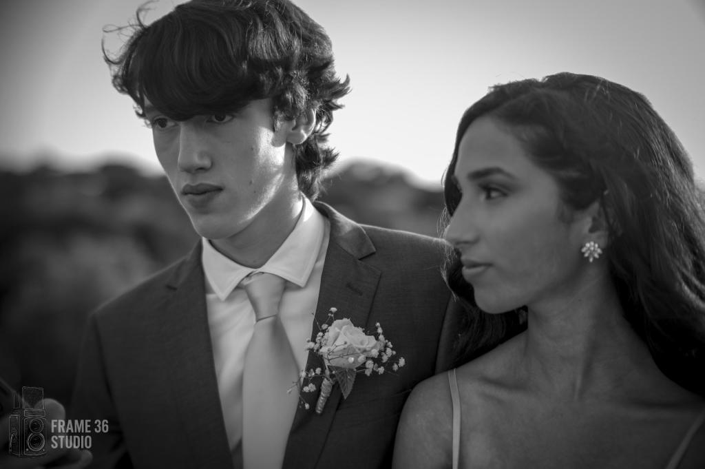 Black-and-white prom portrait of a young couple