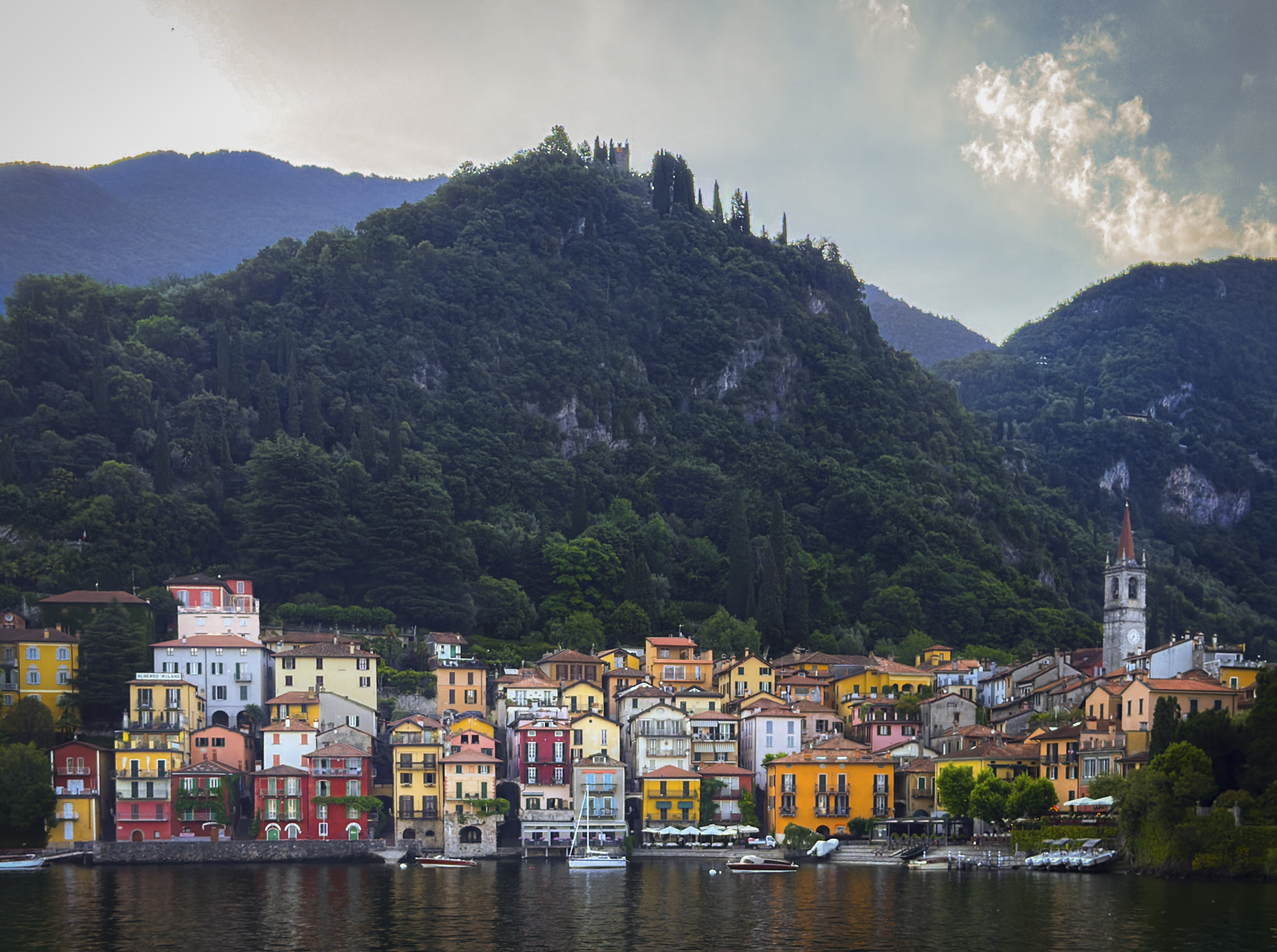 Colorful waterfront buildings and mountains in Varenna on Lake Como
